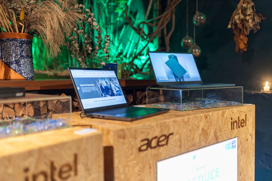 Showcasing Acer laptops with Intel processors at a contemporary tech event