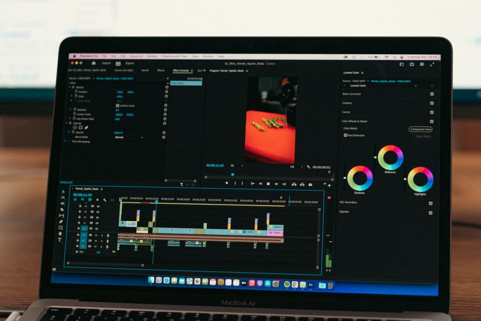 Close-up of video editing software on a laptop screen in a professional setting