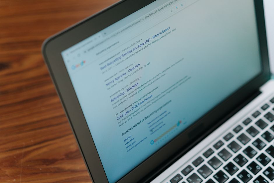 A close-up view of a laptop displaying a search engine page