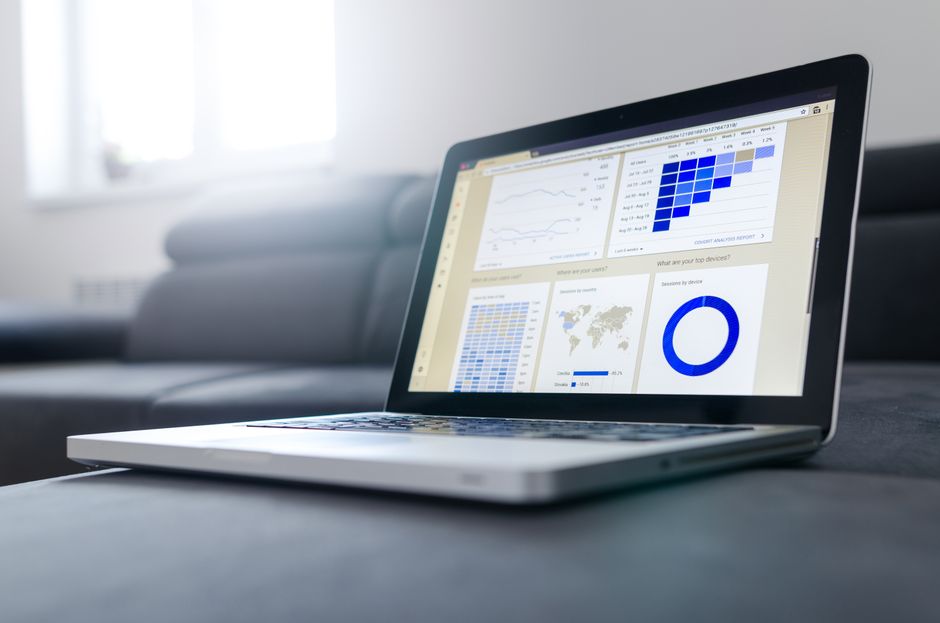 Sleek laptop showcasing data analytics and graphs on the screen in a bright room